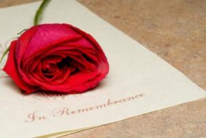 Photo of rose on wedding invitation						